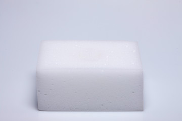 a white sponge in a white background.