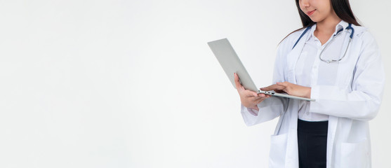 Female  Doctor or physician holding a laptop for checking patient health in hospital, Concept of online healthcare information and emergency healthcare assistance service, Medical service