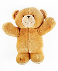 Toy teddy bear on a white background, macro, isolate
