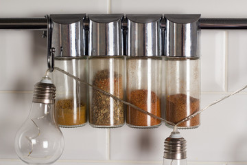 spices in glass jars on the kitchen table
