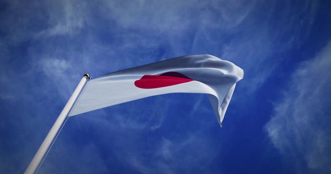 Japan flag flying in the wind on flagpole. Japanese emblem in the sky shows pride - 3d video animation