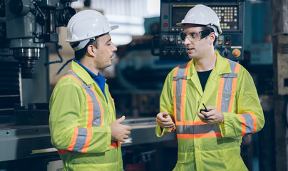 technician engineer and Maintain worker control machine to automated CNC in factory