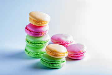  Beautiful biscuits of different colors for tea on a white background.