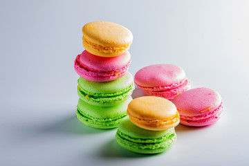  Beautiful biscuits of different colors for tea on a white background.