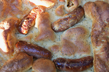 A pile of food or toad-in-the hole savoury dish