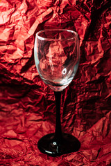 Wine glass on red background