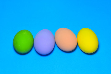 Easter eggs and text space on a blue background.