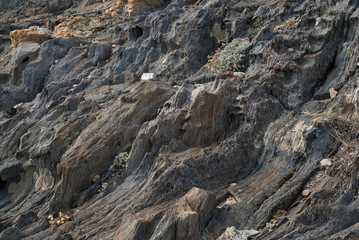 Fototapeta na wymiar Natural stone texture. Rock texture. Cliff surface. Layered rock. Beautiful natural stone. Sandstone. Nature. Travel.