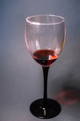 Glass of red wine on a dark background