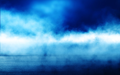 Blue abstract background of the night sky, reflection of the lights of the night city on the pavement. Smoke, fog, smog.