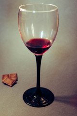 Glass of red wine on a dark background