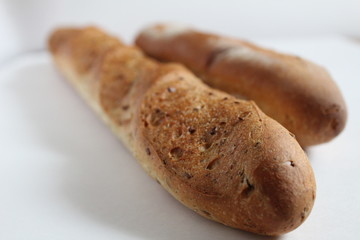 French Greek baguette close up on a white background
