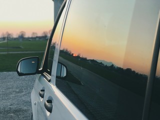 mirror image of a sunset in a van