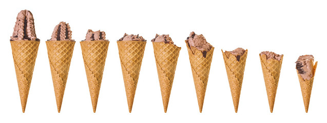 set ice cream in a waffle cone, different stages of eating