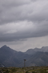 Sign at the top of the hill. A wooden sign placed on top of the pass.