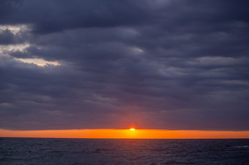 Sunrise on the beach. Sunrise on a cloudy day from the beach.