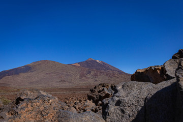 Plains of volcanic rock in Tenerife with clear blue skies