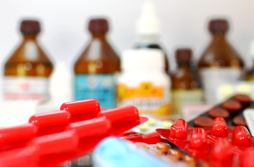 Medical still life Medical preparations with tablets, capsules, alcohol, hydrogen peroxide, thermometer, vitamins, iodine, packages with medicines