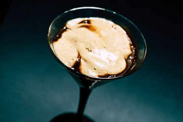 Chocolate dessert with foam in a glass