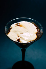 Chocolate dessert with foam in a glass