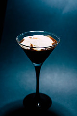 Chocolate dessert with foam in a glass