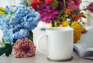 Flowers with a coffee cup