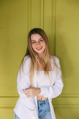 Candid woman with perfect teeth and smile looking at camera