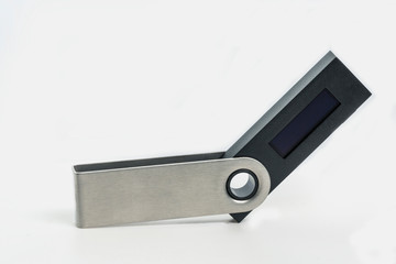 Close up of a opened hardware wallet isolated against a white background