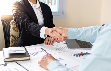 Financial accountants and marketers shaking hand to congratulate the double-digit real estate...