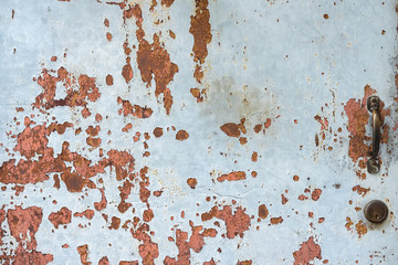 Dirty rusty old metal door . The old rusty metal plate surface.