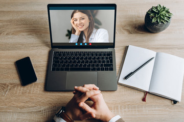 Video call. Face of a smiling girl on a laptop screen. A guy and a girl communicate via video...