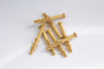 yellow dowels on a white background