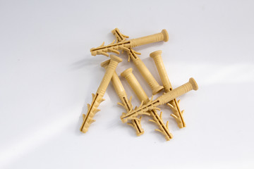 yellow dowels on a white background