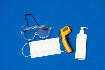 Protection items - glasses, infrared thermometer, antiseptik, medical mask. Covid-2019