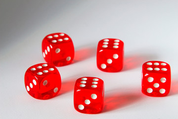 five red dice on a white background, dropped to all sixes