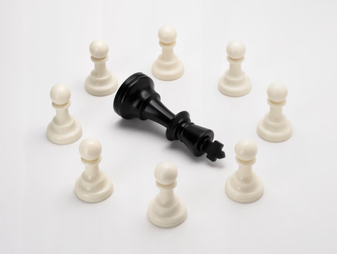 Black king chess dies by pawn chess for business concept - Unity is strength, strategy, Leader, Power, Success, Competition, Different, Win lose. Set of black & white chess isolate on white background