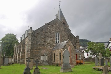 Fototapeta premium The former church of Moulin, built in 1873, and graveyard. Near Pitlochry, Scotland. The church is now a Heritage centre. UK, Europe.
