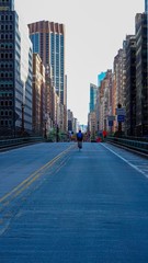 Fototapeta na wymiar Man Running on Park Ave during NYC Quarantine 
