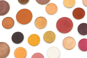 Round multicolored make up eyeshadows isolated on white.