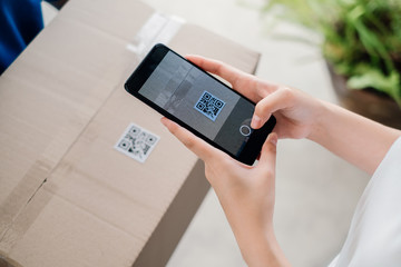 QR Code Scaning door to door delivery express sending send a package to customer receiver sign with...