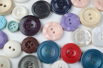 Multicolored buttons on white background