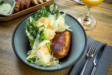 Roman lettuce salad with grilled chicken breast