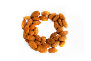 A wreath / circle lined with almonds. Almonds isolated on white.