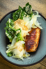 Roman lettuce salad with grilled chicken breast