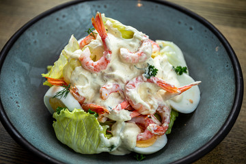 Roman lettuce salad with Caesar sauce, prawns