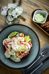 Roman lettuce salad with Caesar sauce, prawns