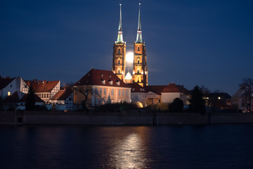 Cathedral Island of Wroclaw with the moon between the towers a night with a bit of haze