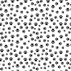 Seamless pattern with dog paw prints on light background.  Vector illustration.