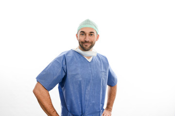 portrait of an handsome man male surgeon wearing surgical scrub suit studio shot isolated on white background