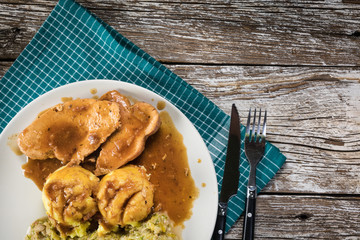 Stewed turkey meat in gravy.